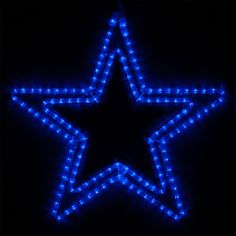 a blue star is lit up in the dark