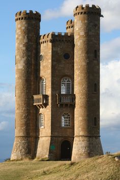 an old castle with two towers on top of it