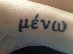 a person's wrist with the word yeew written in cursive writing