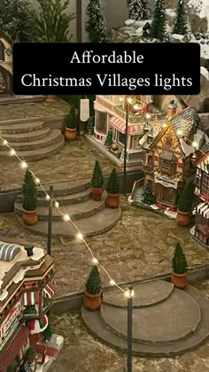 a christmas village is shown with lights and trees