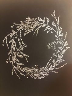 a drawing of a wreath on a blackboard