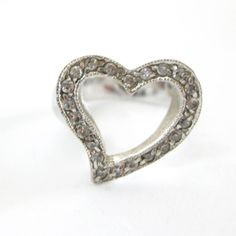 Open heart sweetheart ring. 925 sterling silver with clear rhinestones. The ring measures to a US size 6. There are no markings on the inside. It is in very nice condition with no signs of wear. Thanks for looking! vintagedame.etsy.com Silver Heart Ring With Charm For Wedding, Silver Heart Charm Ring For Wedding, Sterling Silver Rhinestone Rings For Anniversary, Silver Heart Ring With Charm For Valentine's Day, Silver Heart Ring For Valentine's Day, Silver Heart Charm Ring For Valentine's Day, Valentine's Day Silver Heart Ring, Silver Heart Ring With Diamond Accents, Silver Heart Ring Stamped 925