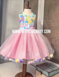 Fabulously fun dress for any Care Bear enthusiast! Bright colors make for the perfect spring and summer combo! We've got a fabulous overlay filled with tiny pastel poms - definitely not your average party dress! Reverse knot style with a twirling skirt! This dress pattern is my own & has been "Blake tested" at the park & playground (and with our pet bunny). It is a real-life dress that is comfortable & doesn't slip off shoulders or get tangled while playing. It is perfect for any spe Care Bear Dress, Dance Shirts Ideas, Cinderella Dress For Girls, Twirling Skirt, Hamster Pet, Care Bears Birthday Party, Care Bear Party, Bear Dress, Care Bear Birthday