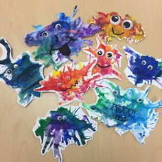 the fish are painted with watercolors to look like they have eyes on them