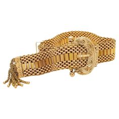 A fine Victorian slide bracelet In 14 karat yellow gold (possibly 15k as some of these were). Comprising a finely woven thick gold mesh band secured with a brite-cut figural buckle shaped clasp, and terminating with gold tassels. Simply a wonderful antique bracelet! Date: Late 19th or Early 20th Century Overall Condition: It is in overall good, as-pictured, used estate condition with some fine & light surface scratches and other signs of light wear consistent with age. Marks: Engraved: E. I. Sta Luxury Ornate Yellow Gold Bracelet, Luxury Victorian Gold Collectible Bracelet, Film Moodboard, Victorian Bracelet, Retro Bracelet, Slide Bracelet, Antique Bracelets, Jewelry Knots, Buckle Bracelet