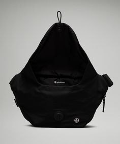 a black bag is sitting on a gray surface and it's zippered to the side