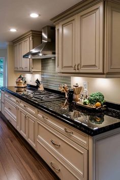 61 Swoon-Worthy Taupe Kitchen Cabinets Ideas for Every Style Kitchen Cabinets With Dark Granite, Tan Cabinets Kitchen, Cabinet Colors With Brown Granite, Chestnut Kitchen Cabinets, Chocolate Kitchen Cabinets, Taupe Cabinets, Chestnut Kitchen, Baltic Brown Granite, Taupe Kitchen Cabinets