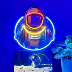 an astronaut on the moon is shown in front of a blue background with neon lights