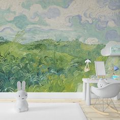 a child's room with a painting on the wall and a white chair in front of it