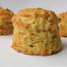 three biscuits are sitting on a white surface