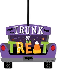 a trunk or treat sign hanging from the side of a car with bats and pumpkins on it