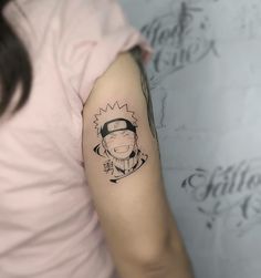 a woman with a tattoo on her arm has a drawing of a man's face