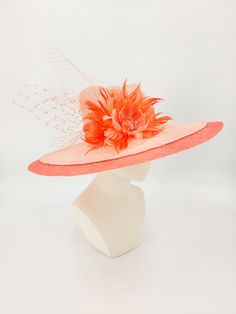 Gorgeous peach parisisal fedora with a hot coral sinamay brim extension. Accented with coral netting and feather flowers. 59cm. Hand stitched using the highest quality materials. One of a kind. Pink Fedora For Kentucky Derby Party, Spring Evening Hats With Feather Trim, Evening Hats With Feather Trim For Spring, Spring Evening Hat With Feather Trim, Spring Top Hat With Feather Trim, Elegant Pink Fedora For Summer, Elegant Red Fedora For Spring, Elegant Pink Summer Fedora, Spring Orange Fascinator With Curved Brim