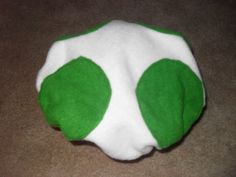 a green and white ball laying on the floor