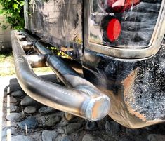 the back end of a vehicle with its exhaust pipe exposed