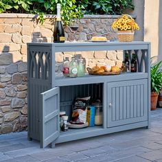 an outdoor bar with food and drinks on it