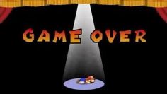 the title screen for game over, which features an image of a stage with a spotlight