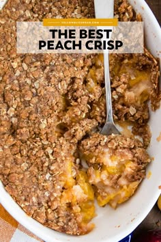 the best peach crisp in a white dish with a spoon