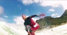 a man riding a wave on top of a surfboard