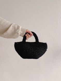 sohn focuses on materials and workmanship to create products that will last a long time. - Hidden magnetic closure detail- Hand knitting tote bag- Light weight and durable bag- Compact size yet spacious storage Modern Crochet Bag With Double Handle For Shopping, Modern Crochet Shopping Bag With Double Handle, Black Bags With Rolled Round Handles, Modern Crochet Tote Bag For Shopping, Black Top Handle Bag With Rolled Handles, Black Handheld Bucket Bag With Detachable Handle, Black Bucket Bag With Top Carry Handle, Black Top Handle Bucket Bag With Handle Drop, Modern Crochet Tote Bag For Everyday Use