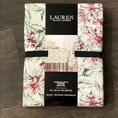 four pieces of white, red and green floral printed napkins on top of each other