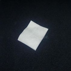 a white napkin on a black tablecloth stock images