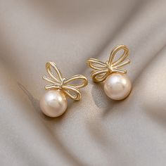 Pearl Type : Simulated-pearl Back Finding : Push-back Style : TRENDY Gender : Women Material : PEARL Shape\pattern : Bowknot Metals Type : Copper Alloy Brand Name : wproduby Earring Type : Stud Earrings Item Type : EARRINGS Fine or Fashion : fashion WHAT ABOUT REFUND?   Fast refund,100% Money Back Guarantee. If your product is defective or doesnt work properly, let us know and well send you a replacement one. We believe in our products so much that we offer a 30-day No-Hassle refund policy. If y Pearl Jewelry With Bow Detail, Elegant Bow Pearl Earrings, Work Accessories, Earrings Elegant, Pearl Types, Earring Type, Body Chain Jewelry, Elegant Earrings, Shape Pattern