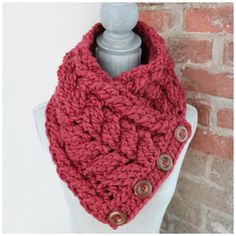 a red knitted cowl with buttons on it