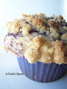 a blueberry crumb muffin sitting on top of a table