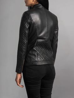 Elevate your outerwear game with the Orient Grain Quilted Black Leather Biker Jacket. Crafted to perfection, this jacket seamlessly blends style and functionality, making it a standout piece in any wardrobe. Crafted from premium quality leather, this jacket boasts a rich black hue that exudes timeless sophistication. The orient grain texture adds depth and character to the jacket, giving it a luxurious feel and a unique look that sets it apart from the rest. The standout feature of this jacket is its quilted detailing, which adds a touch of classic charm to the modern biker silhouette. The intricate stitching not only enhances the jacket's aesthetic appeal but also provides extra warmth and comfort, making it the perfect choice for cooler weather. Whether you're hitting the open road on yo Fitted Moto Outerwear With Padded Collar, Black Fitted Quilted Jacket, Black Quilted Biker Jacket For Fall, Quilted Fitted Biker Jacket For Fall, Black Fitted Quilted Outerwear, Fitted Quilted Biker Jacket For Fall, Fitted Black Quilted Outerwear, Black Quilted Biker Outerwear, Fitted Quilted Biker Outerwear