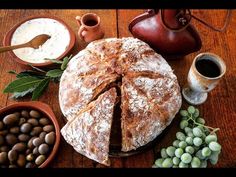 a table topped with bread and other foods