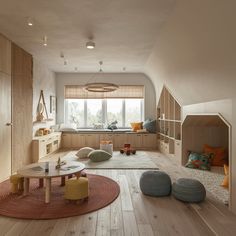 a living room filled with furniture and lots of windows