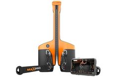 an orange and black device is next to a cell phone