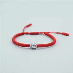 Tibetan Red String bracelet Buddha Charm Bring Protection and Good Luck upon you with this Blessed Tibetan Lucky Rope Bracelet. This is another original version of our Lucky Rope bracelet series. Red string Bracelet For Good Luck! Our Tibetan Lucky Red Bracelet is hand-knotted by Tibetan Monks, but more special is the blessings received while being knotted. A Tibetan knot Bracelet is infused with Mantras (prayers) and is believed to bring many good things to the wearer: Invites Good Luck Brings Chinese Knotting Cord, Chinese Knotting, Tibetan Bracelet, Moon Dance, Bracelets With Meaning, Buddhist Prayer, Red String Bracelet, Lucky Bracelet, Red String