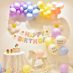 a birthday party with balloons and decorations