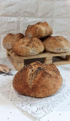 several loaves of bread sitting on top of a table