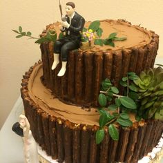 a wedding cake with a bride and groom on top