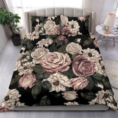 an image of a bed with flowers on the comforter and pillow cases in it