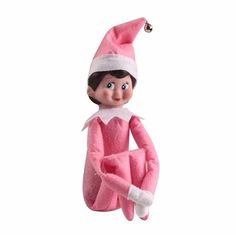 a pink elf doll hanging from the ceiling