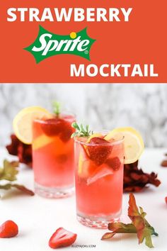 two glasses filled with strawberry sprite cocktail on top of a white table next to strawberries