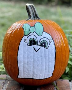 a painted pumpkin with an image of a chicken on it