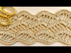 a crocheted lace with scissors on it