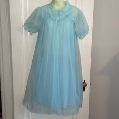 Vintage 60s Helen Of Troy Light Blue Nylon Robe & Nightgown Set With Floral Embroidered Necklines Small Excellent Vintage Condition Looks Like It Was Hardly Worn Robe Armpit To Armpit Is 21” Length Is 43” Nightgown Armpit To Armpit Is 21” Length Is 40” Just Gorgeous Cottage Core Blue Sheer Sleep Dresses, Sheer Blue Sleep Dresses, Sheer Blue Sleepwear For Spring, Vintage Sheer Dresses For Bedtime, Sheer Blue Nightgown For Bedtime, Vintage Light Blue Nightgown For Spring, Light Blue Sheer Dress For Daywear, Blue Sleepwear For Wedding Night In Spring, Vintage Blue Nightgown For Home