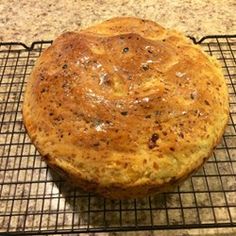 a baked pastry sitting on top of a cooling rack