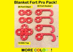 four red plastic pieces with the words blanket fort pro pack written on them and in different font