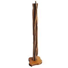 a tall wooden pole with two sticks sticking out of it's sides and on top of a stand