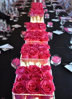 the long table is decorated with pink roses