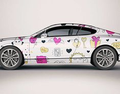 a white car with hello kitty designs on it