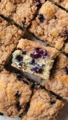 blueberry crumb bars cut into squares on a plate