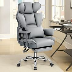 a gray office chair sitting on top of a hard wood floor